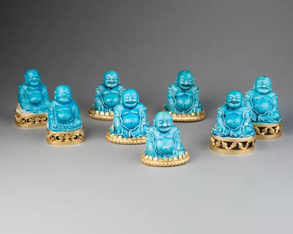 Collection de huit figures de Budai en biscuit turquoise, Chine 18 ème