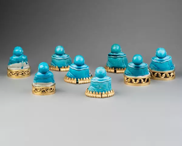 Collection de huit figures de Budai en biscuit turquoise, Chine 18 ème