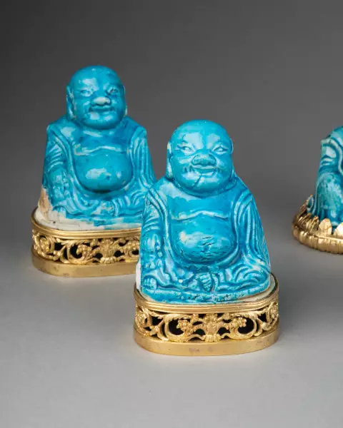Collection de huit figures de Budai en biscuit turquoise, Chine 18 ème
