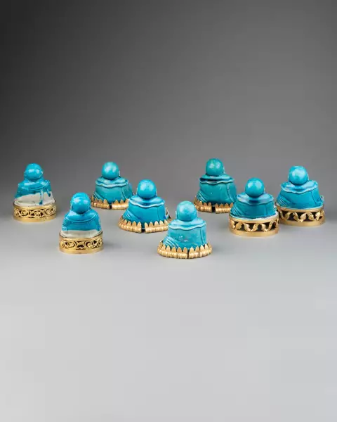 Collection de huit figures de Budai en biscuit turquoise, Chine 18 ème
